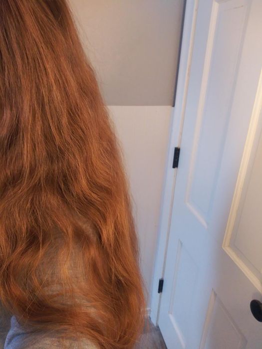 A reviewer with frizzy, long hair