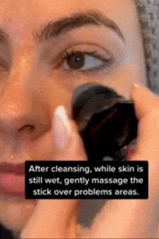 TikToker using the scrubber on their nose and cheeks.