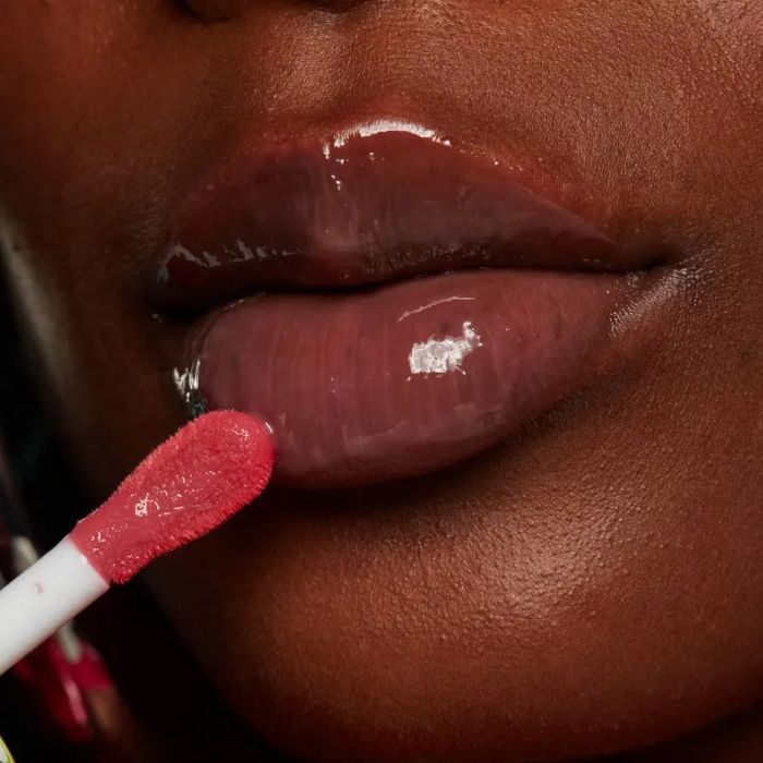 A model applying the lip gloss