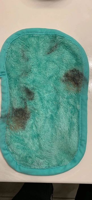 a reviewer's light blue cloth with makeup stains