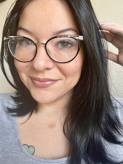 A reviewer wearing a taupe-pink shade