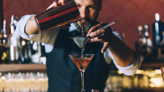 How to Get a Bartender's Attention Without Coming Across as Pushy