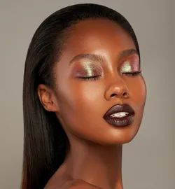 a model wearing pink and gold eyeshadow
