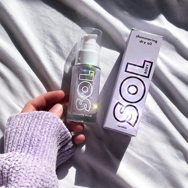A bottle of shimmering body oil ready to give you that ethereal glow.