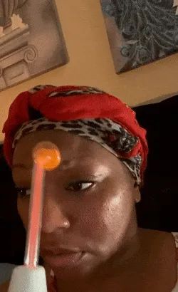 gif of reviewer gliding the glass tube across their face