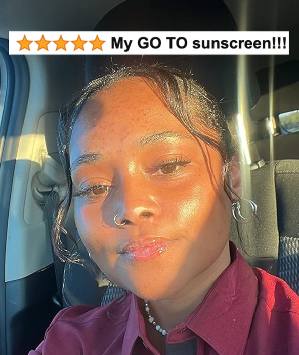 A person in a maroon shirt, sitting inside a car with sunlight shining on their face, with text above reading: