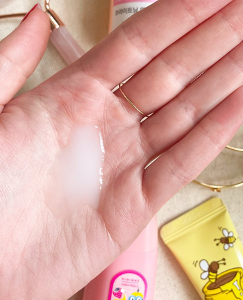 A model showing the white toner applied to their hand.