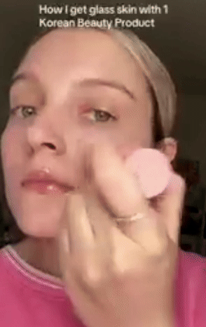 Model demonstrates how to apply the multi-balm on her face