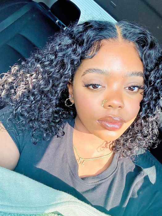 A reviewer basking in direct sunlight, showcasing dewy skin