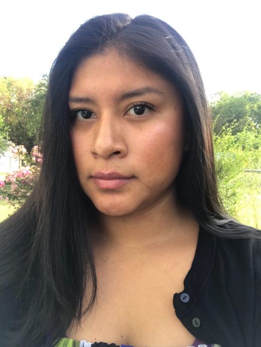 Another reviewer sporting sleek, straight hair.