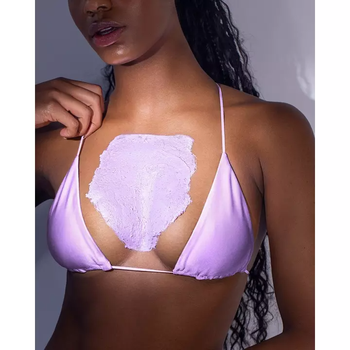 A model showcasing the chest with boob polish applied.