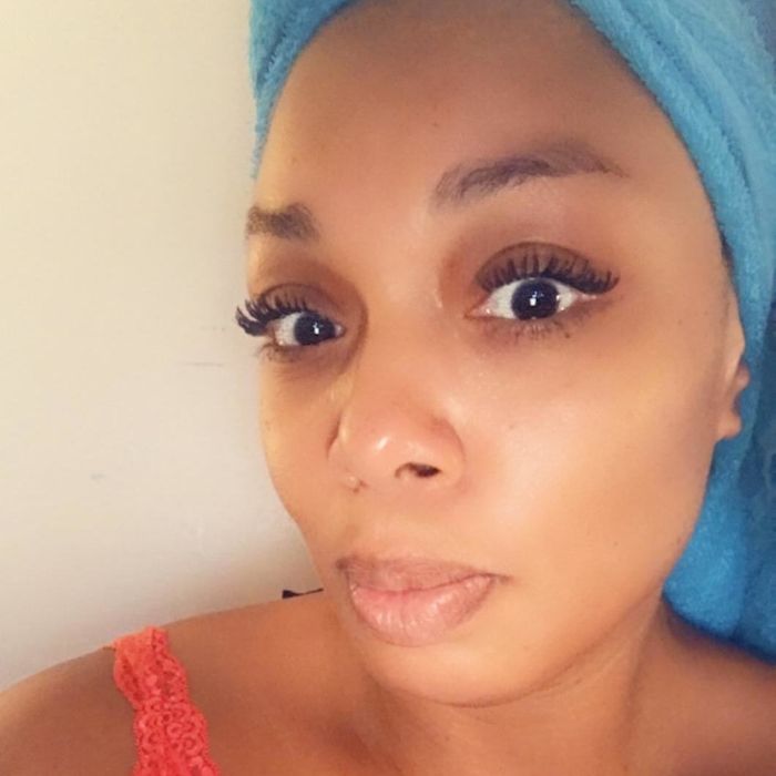 Reviewer proudly showing off their luscious, full lashes after applying the mascara