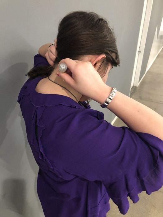 Mytour editor applying the roll-on stick to the nape of her neck