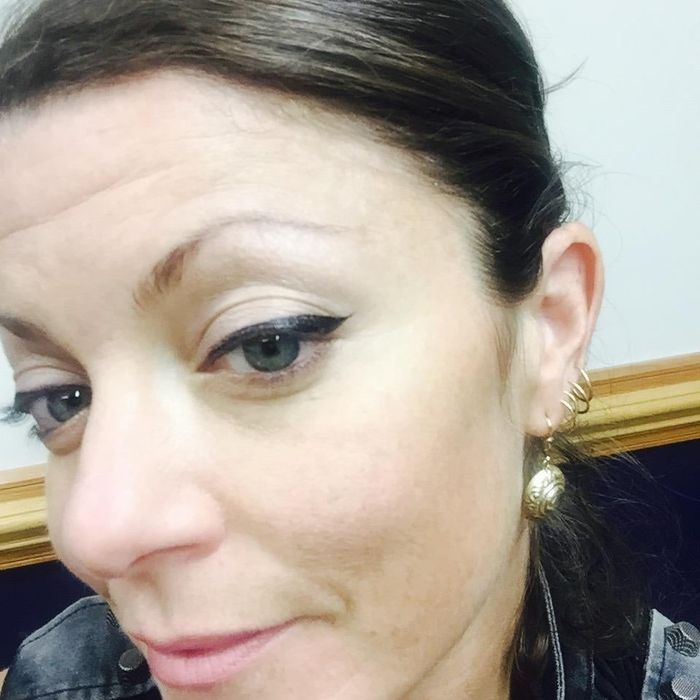 A reviewer rocking the classic cat-eye eyeliner look