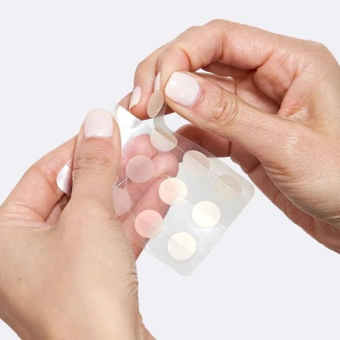 Model wearing pimple patches