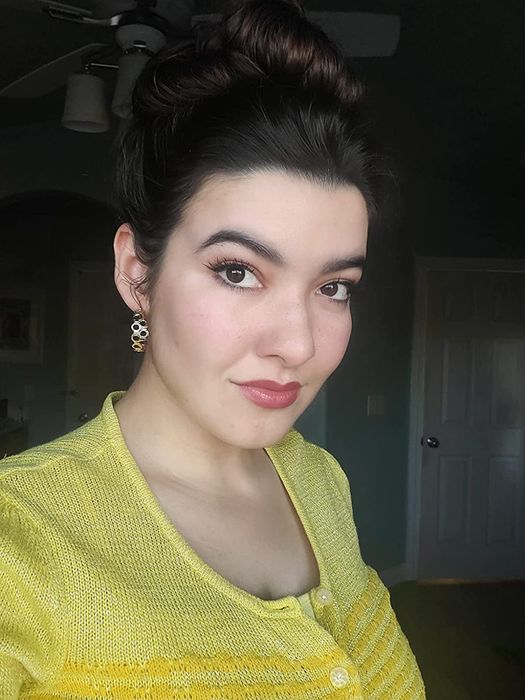 A reviewer using the multi-stick as blush, with a delicate pink tint on their cheeks.