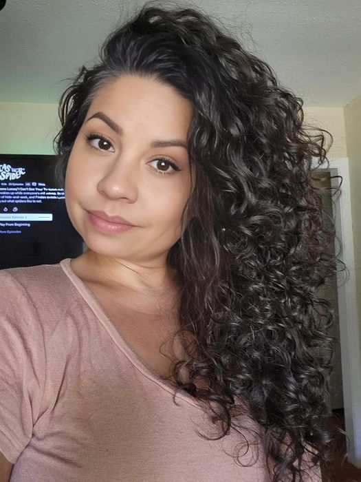The reviewer's hair after using Wrap Me Lotta Body mousse