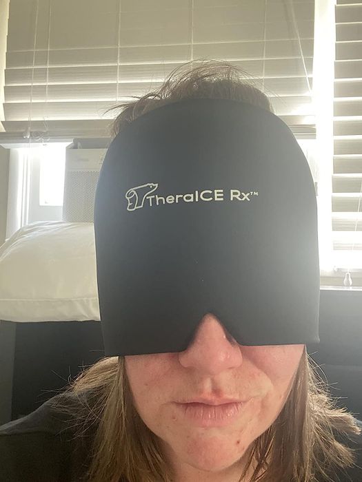 Another reviewer wearing the cap over their eyes