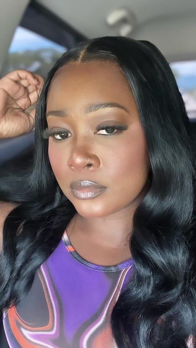 A reviewer wearing the E.l.f. camo liquid blush