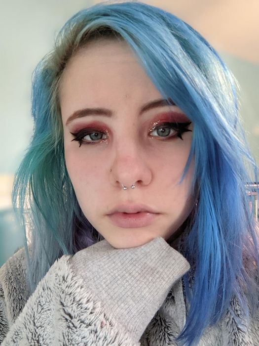A reviewer sporting bold, dark liquid eyeliner
