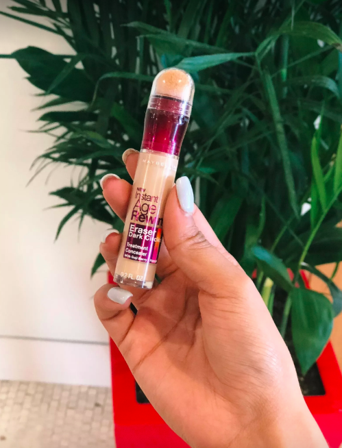 A Mytour editor holding the concealer stick