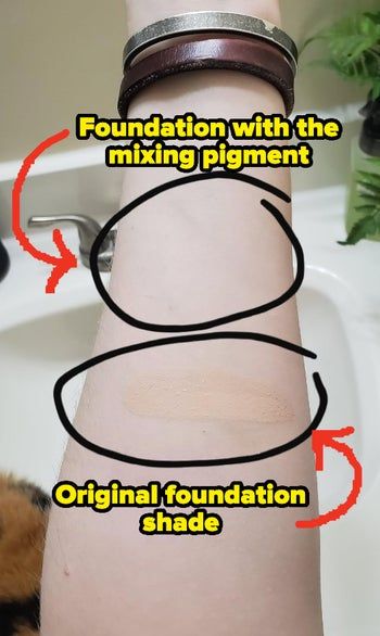Reviewer showing off two makeup swatches, with the top one labeled.