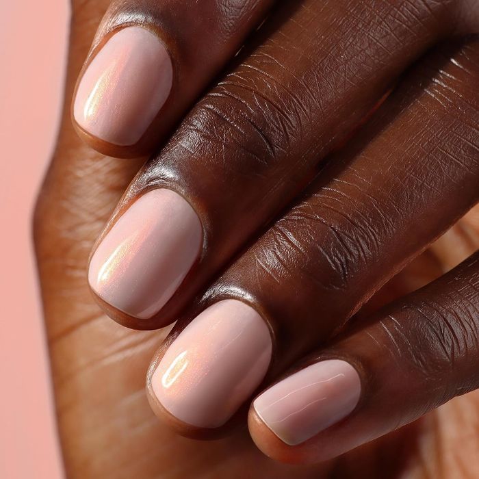 A close-up of a fresh pink manicure