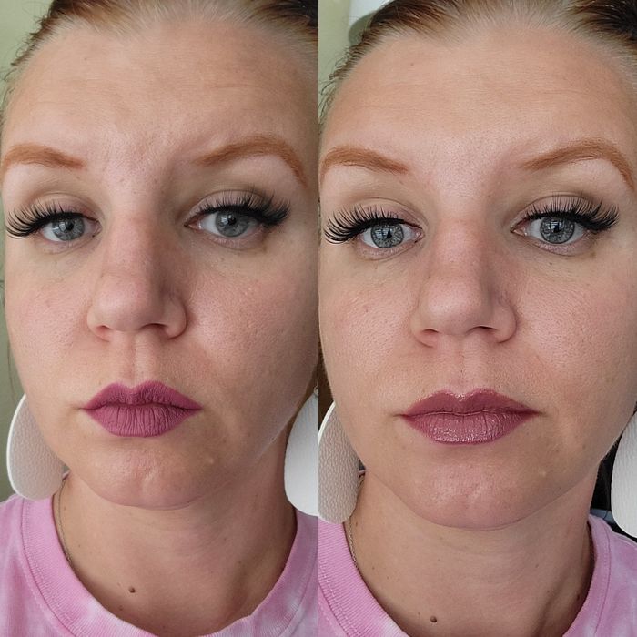 A reviewer showcasing their lips with two shades of gloss applied.