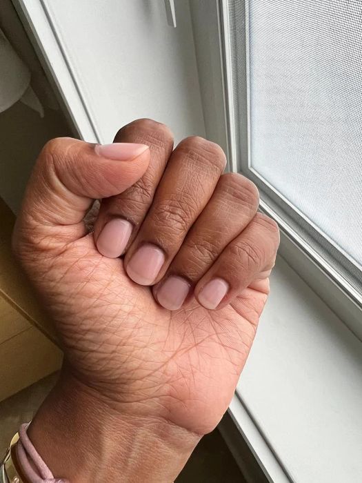 A reviewer’s nails with the Londontown Illuminating Nail Veil Concealer applied.
