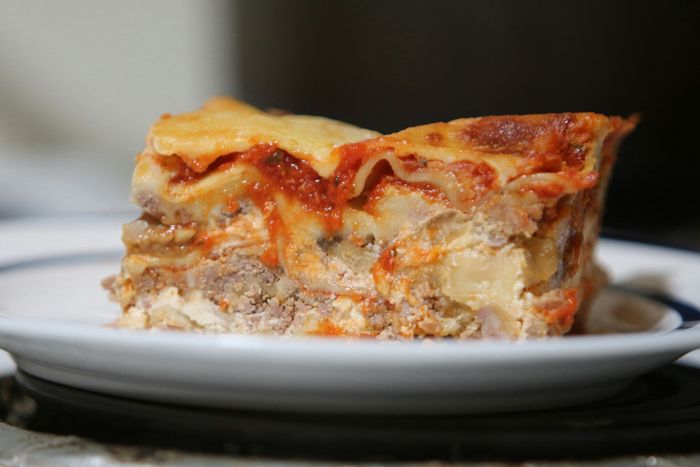 a slice of lasagna resting on a plate