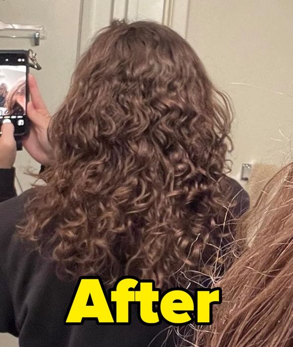 A reviewer's hair after using the Briogeo spray, showcasing the shiny transformation