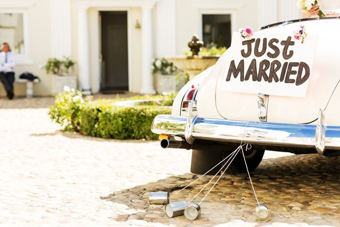 A wedding car adorned with a 