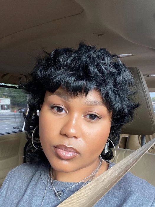 A reviewer showcasing a radiant makeup look