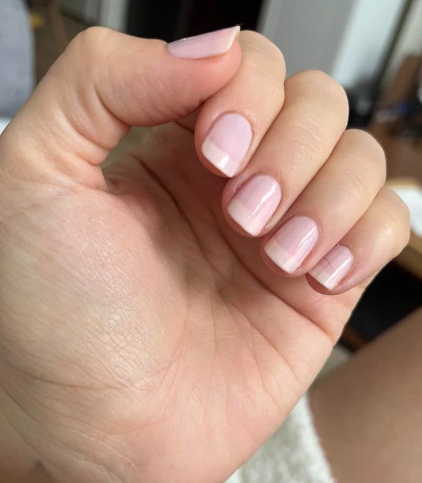 Reviewer's nails after applying the nail concealer