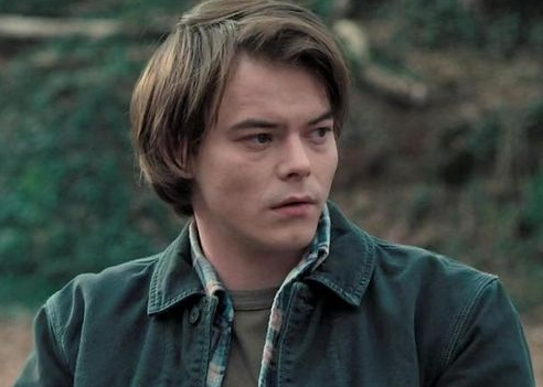 Jonathan standing in a forest