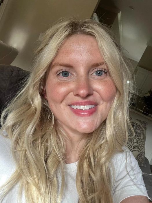A reviewer applying L'Oreal Paris Makeup True Match Lumi Glotion for a radiant look.