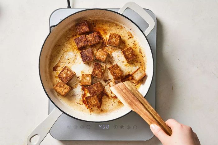 Shallow frying tofu in a pan