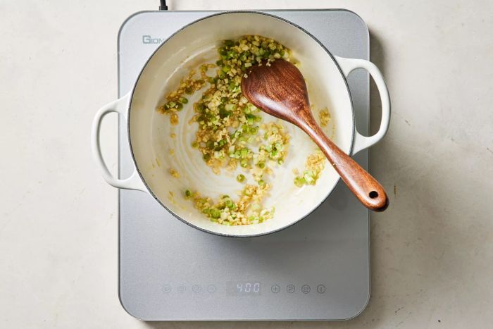 Scallions cooking with garlic and ginger