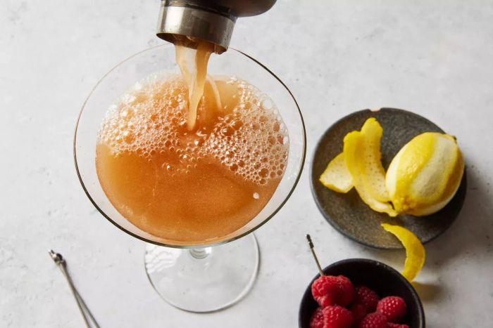 The Chambord martini being poured gracefully into a martini glass