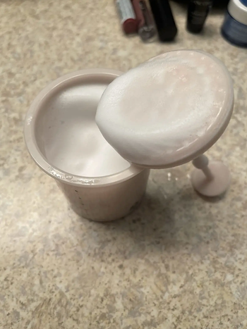 The inside of the Marshmallow Whip Maker with foamy cleanser inside.