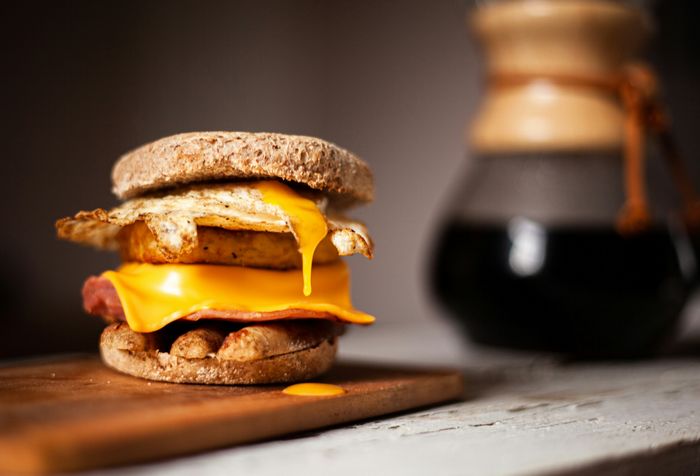 a freshly baked burger on a wooden surface