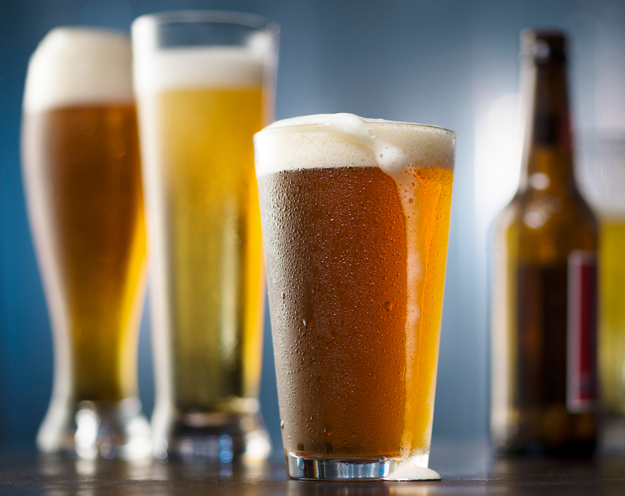 Beer glasses and bottles in a casual setting