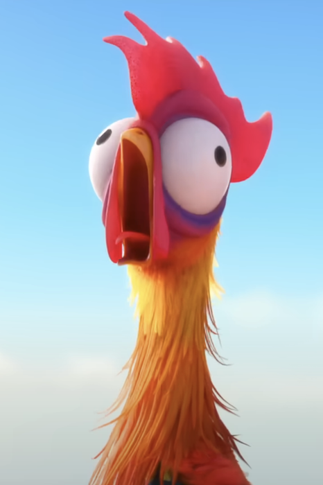 A cartoon rooster with wide eyes and an open beak, appearing surprised, set against a bright, clear sky.
