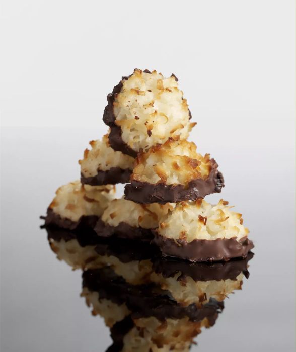 Close-up image of chocolate-dipped macaroon.