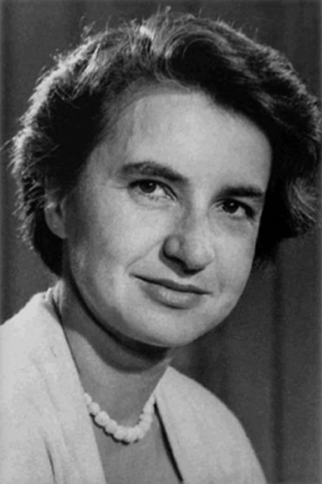 A woman with short hair, a subtle smile, and a pearl necklace. She exudes professionalism in this likely historical portrait. Perfect for a reflection piece