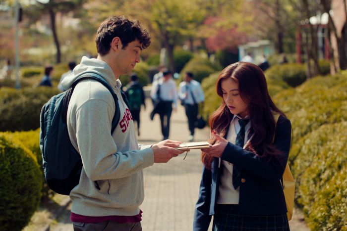 Peter handing Kitty a pile of letters.