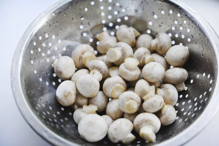 Washing Mushrooms in a Colander