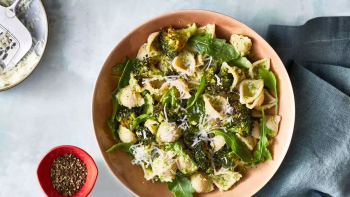 Roasted Broccoli Pesto Pasta Served in a Bowl with Grated Cheese on the Side