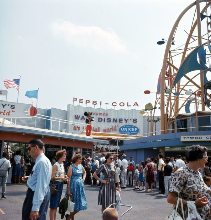 A 1964 New York World's Fair scene with visitors, featuring signage for Pepsi-Cola and the iconic