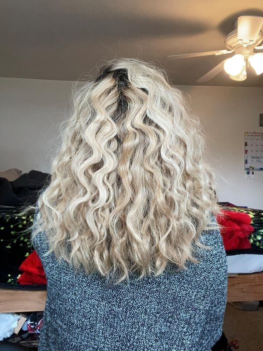 Reviewer's hair styled into soft waves